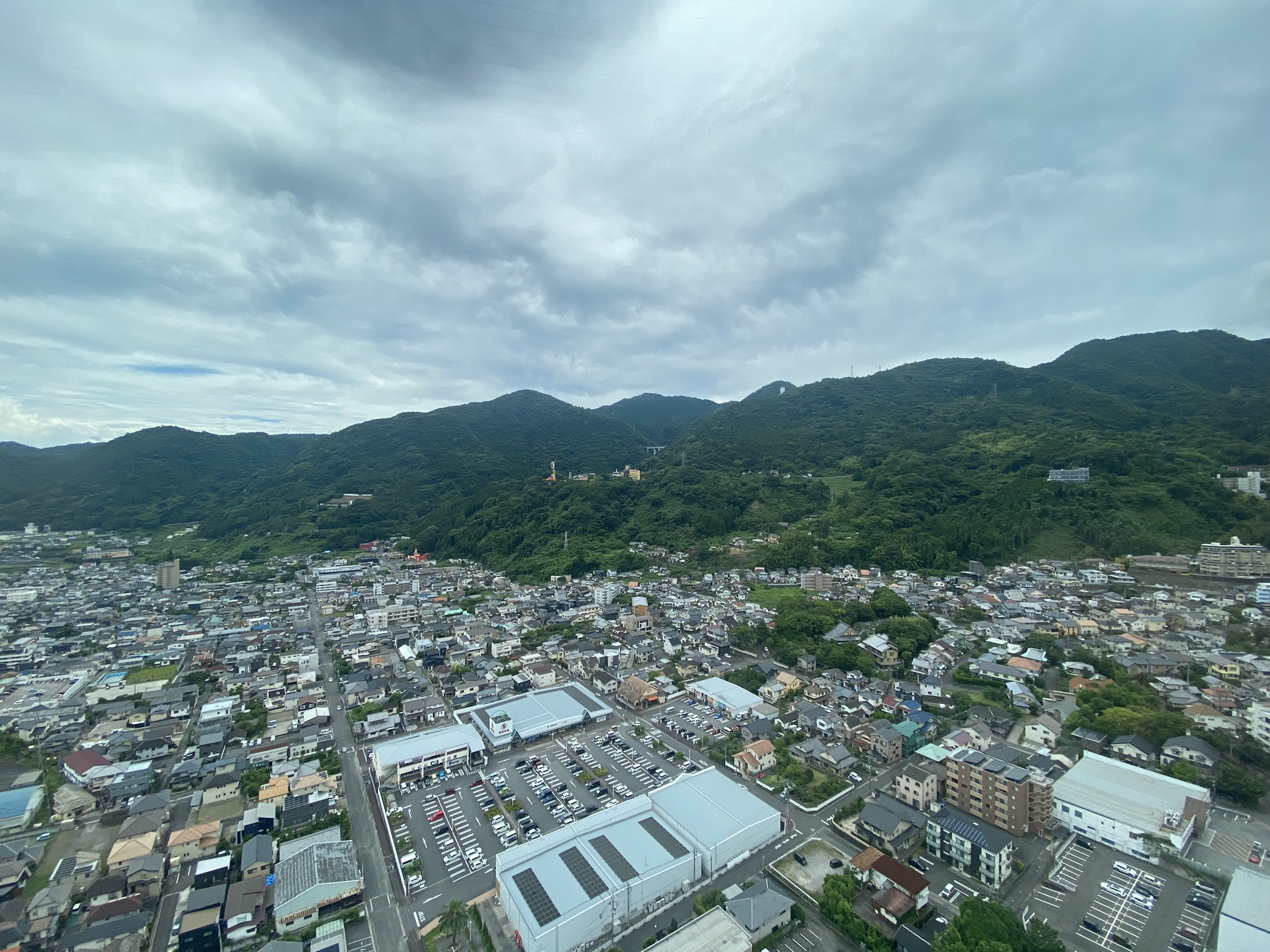 Beppu ryokan onsen outdoor bath view mountain sea traditional Japanese inn relaxation