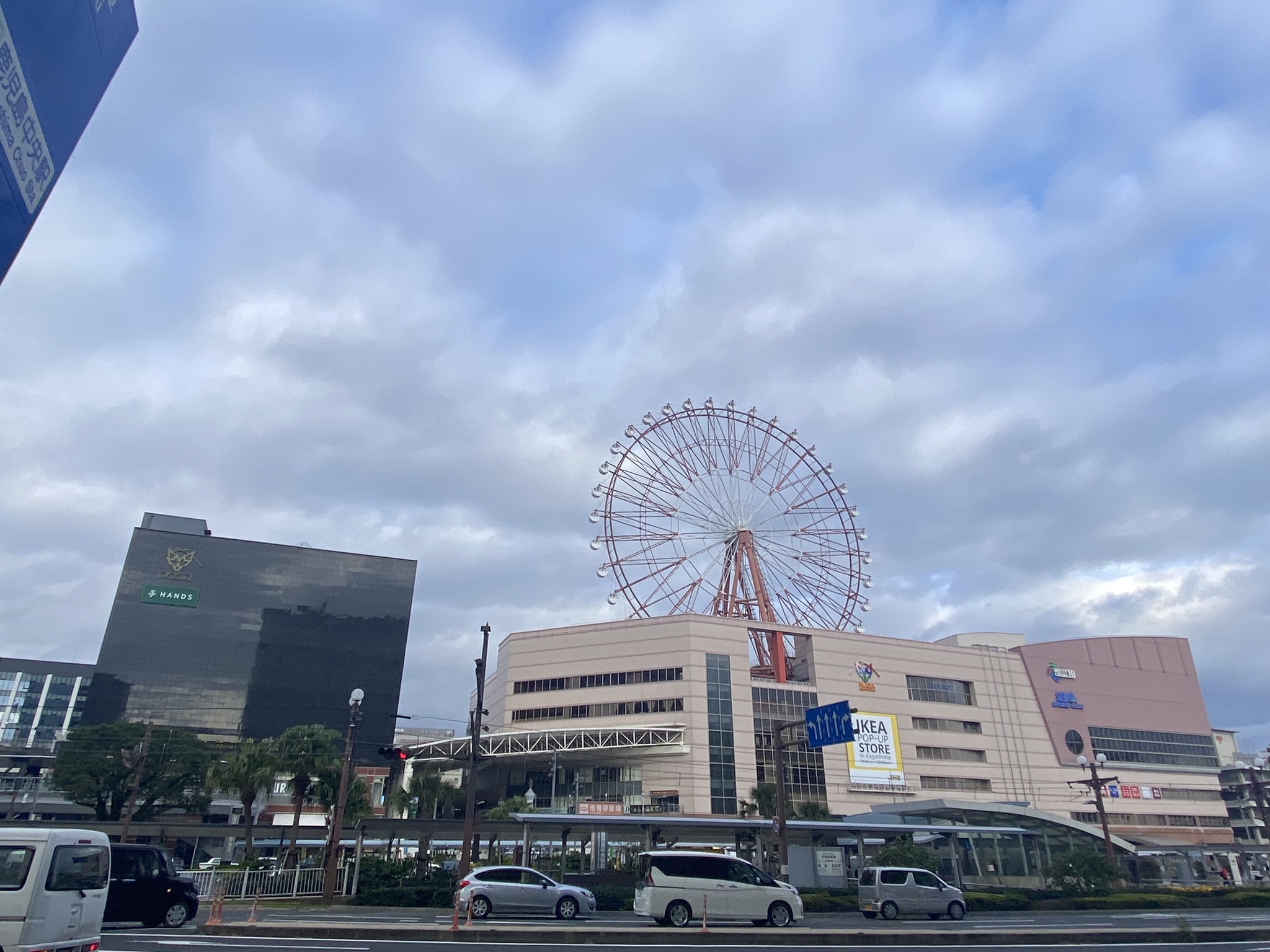 Kagoshima Chuo Station daytime ferris wheel Amyu Rahn and HANDS building exterior