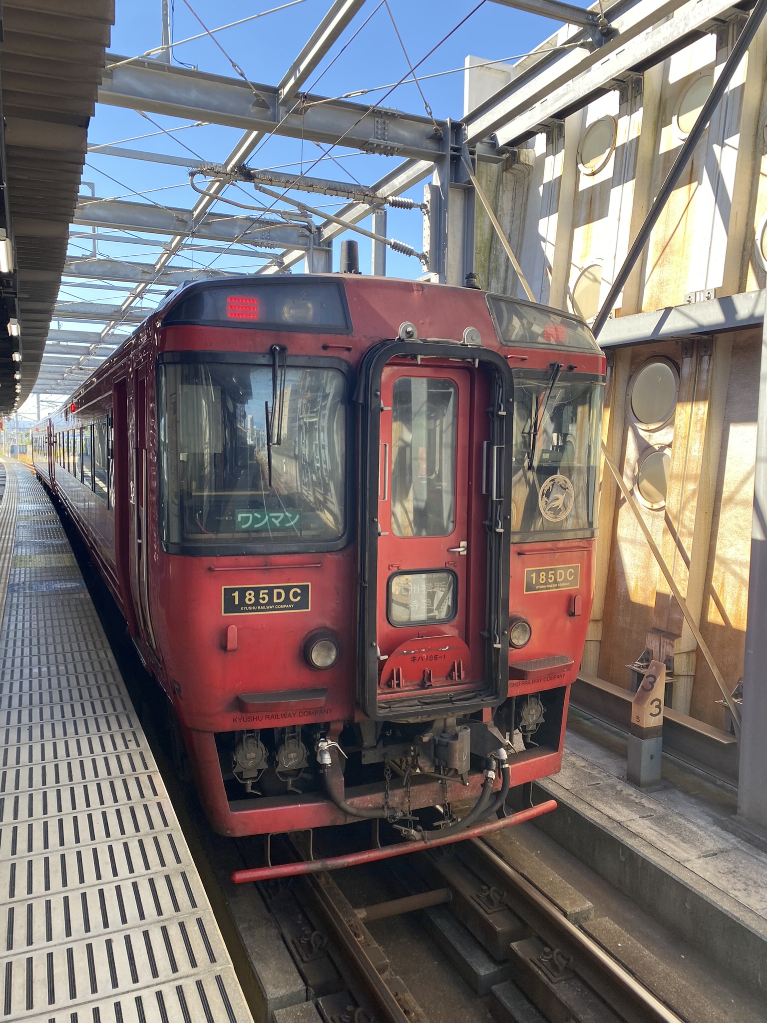 Kumamoto Electric Railway red 185DC single car train at Hikarinomori station platform