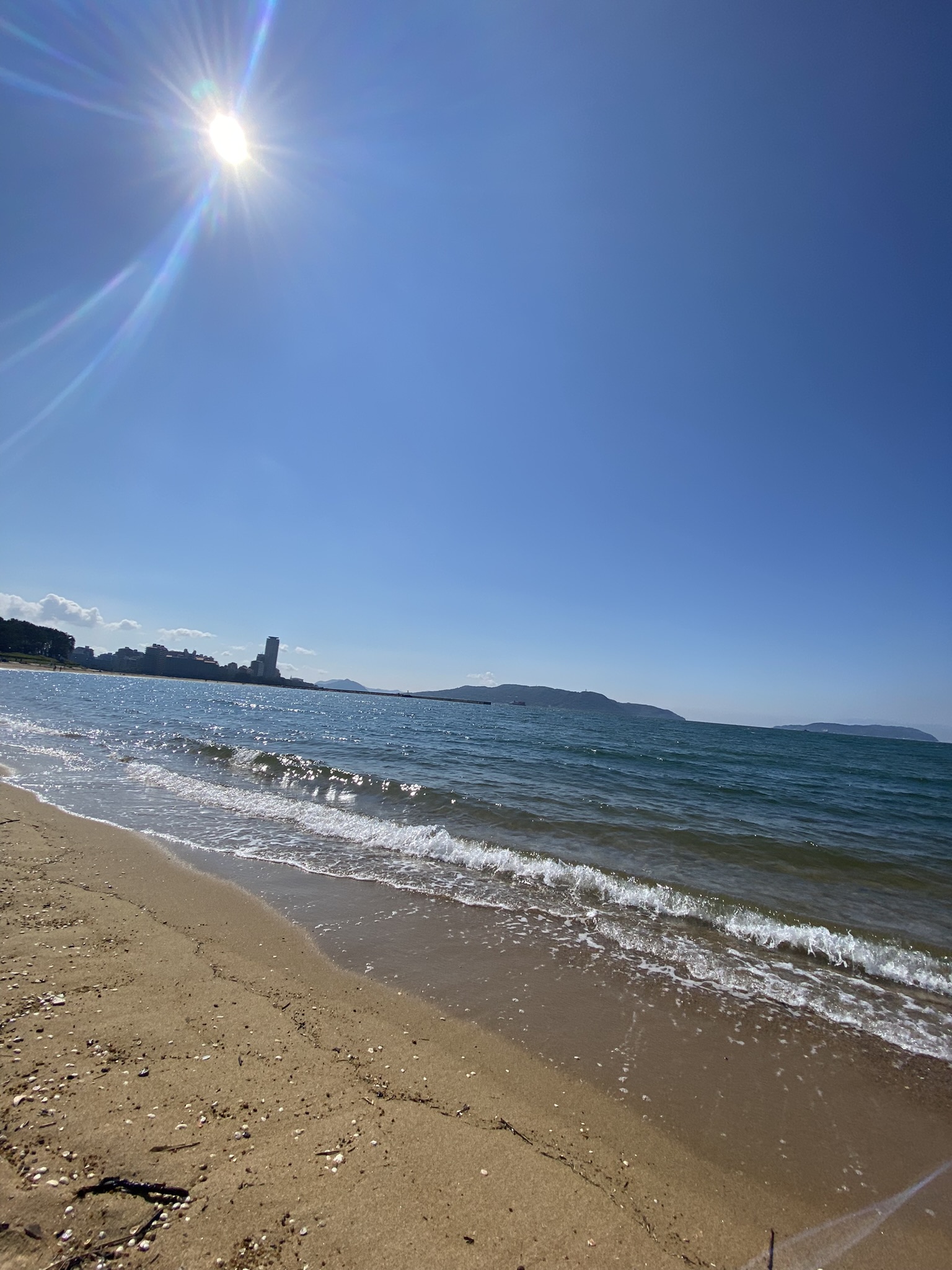 Momochihama beach shoreline with gentle waves