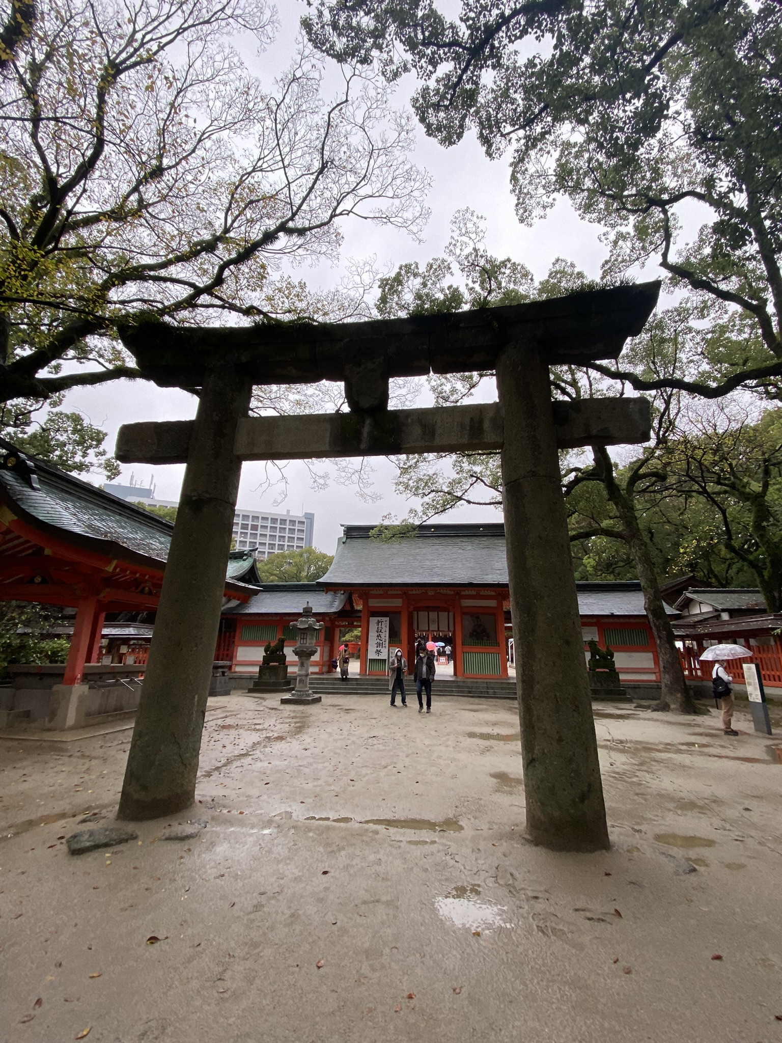 Large torii gate in front of the main hall at Sumiyoshi Shrine Fukuoka in the rain